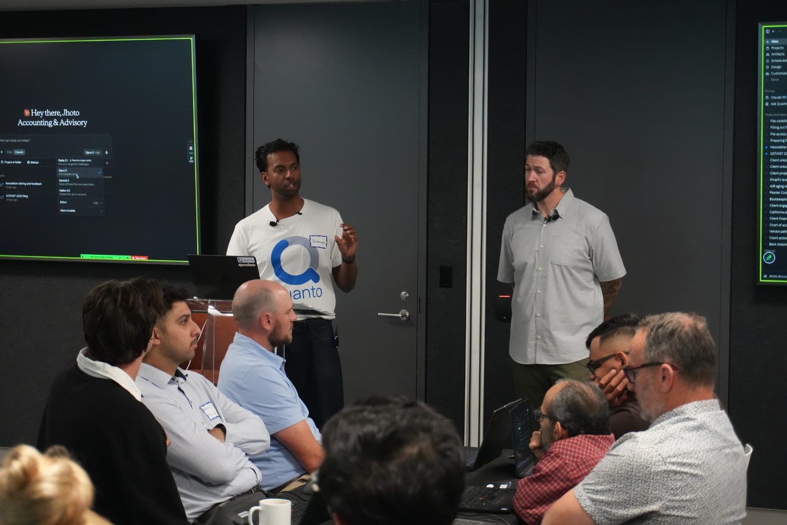 Anderson Petergeorge and a Quanto team member speaking to the room